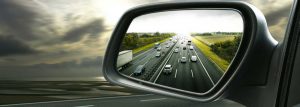 view of freeway traffic from car review mirror